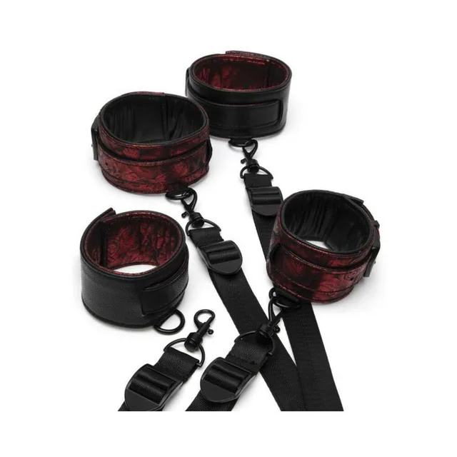 Four red-and-black restraint cuffs connected by adjustable black straps