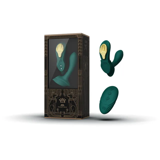 Zalo Legend Aya Turquoise Green dual-arm vibrator with remote beside the windowed black and gold retail box