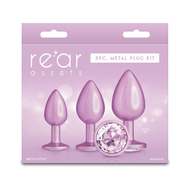 Three graduated iridescent-pink Rear Assets metal plugs with round gem bases