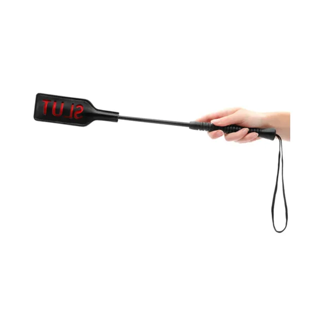 Black Ouch crop with SLUT paddle, wrapped handle and wrist loop