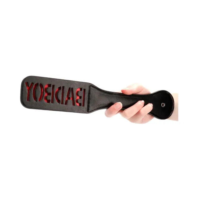 Black Ouch paddle with red BAD BOY lettering and rounded handle