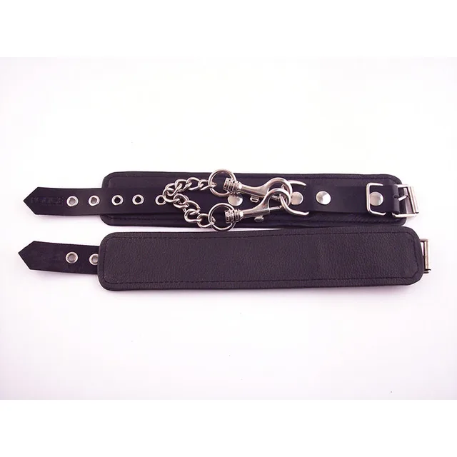 Rouge black leather wrist cuffs with buckles rings and connecting chain