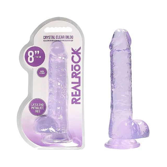 Purple RealRock Crystal Clear 8-inch dildo beside retail pack