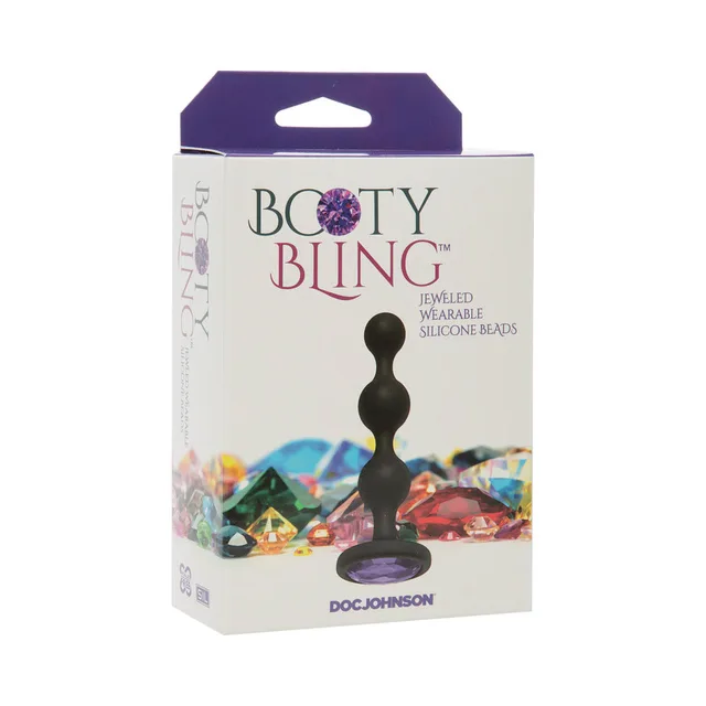 Doc Johnson Booty Bling purple-jewel silicone beads beside white-and-purple jeweled retail box