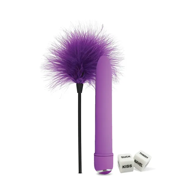 Purple mini wand beside feather tickler and two white dice