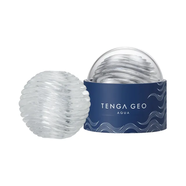 TENGA GEO Aqua clear stroker clear sphere beside the open dark blue storage base