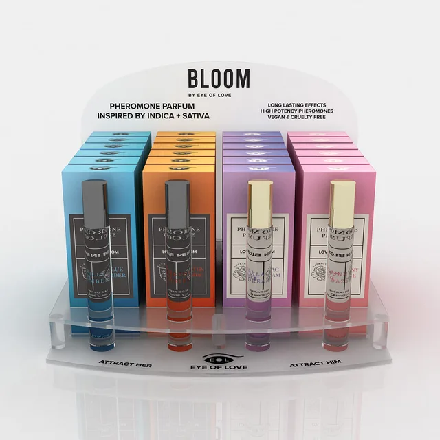 clear Eye of Love Bloom acrylic display holding four color-coded parfum boxes