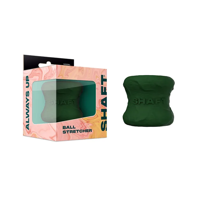 green Shaft Model H hourglass-shaped ball stretcher beside windowed box