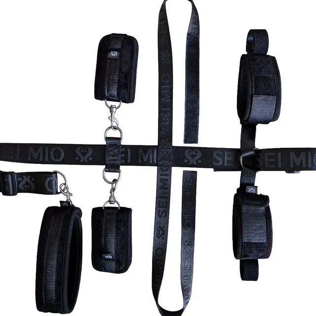 Black under-chair straps with four padded cuffs and metal clips