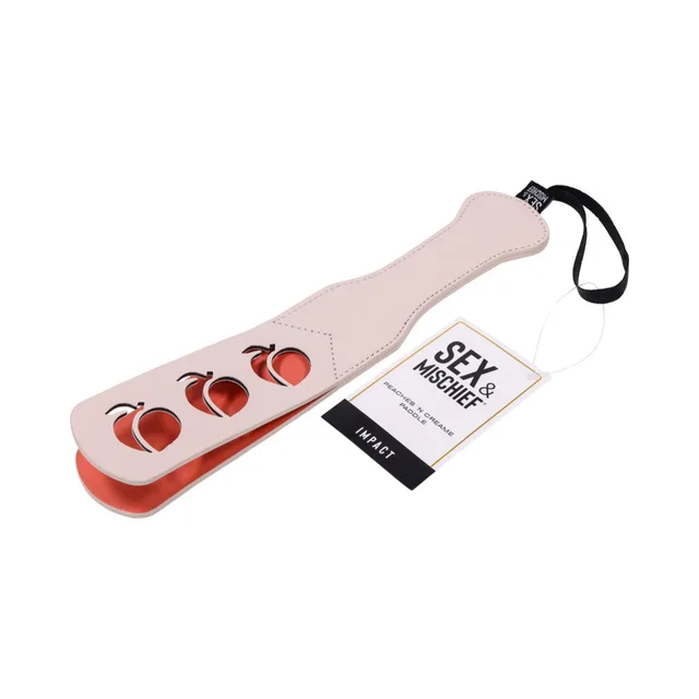 peach-tone faux-leather paddle with peach cutouts and black wrist strap
