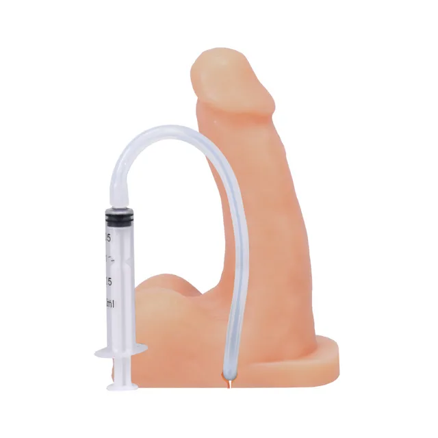 Cream POP n Play packer beside connected graduated syringe