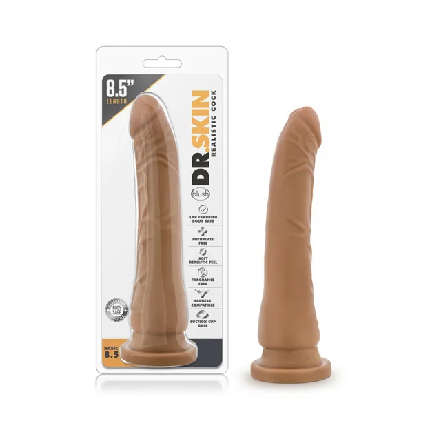 Blush Basic 8.5 tan dildo beside clear Dr. Skin retail package