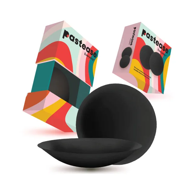 Pastease Everyday black silicone breast covers for D+ cups two colorful travel boxes behind the round black covers