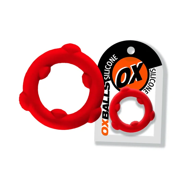 Red Oxballs Spinner ring with six raised nodes beside card