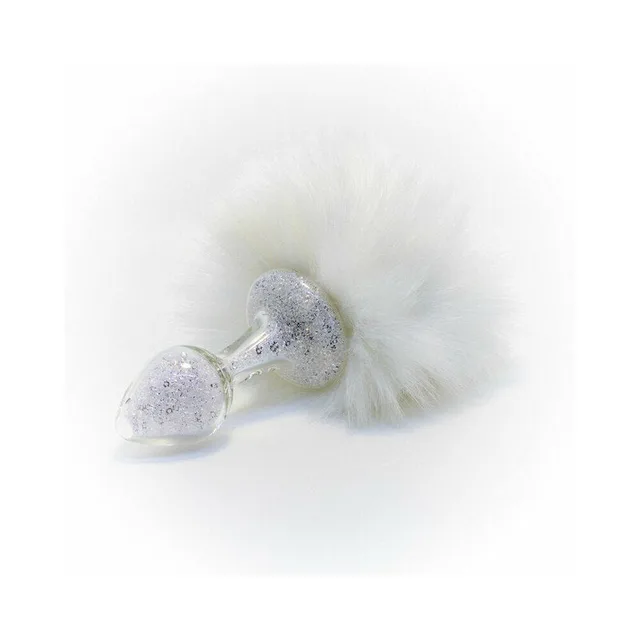 white magnetic bunny tail beside silver-sparkle glass plug