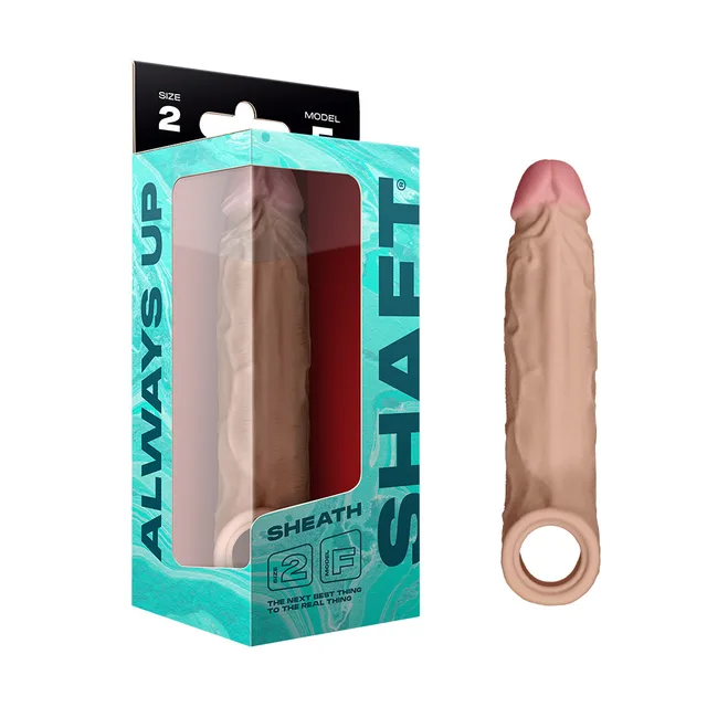 Pine Size 2 Shaft Model F silicone sheath with ringed base beside aqua box