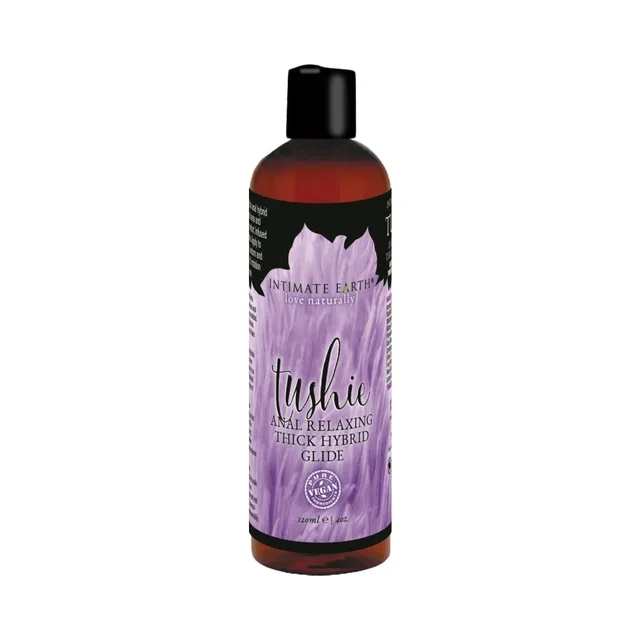 Four-ounce Intimate Earth Tushie hybrid glide in tall amber bottle