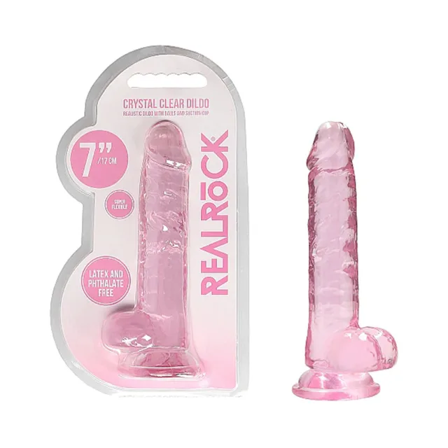 Pink RealRock Crystal Clear 7-inch dildo beside retail package