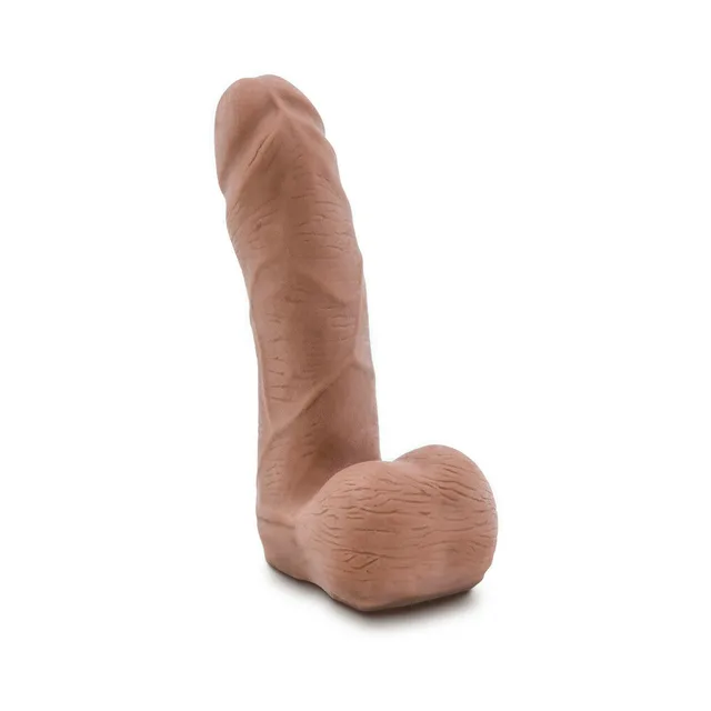 Upright tan Carlito dildo with molded shaft and suction base