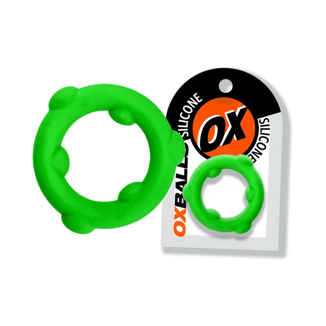 Frog green Oxballs Spinner ring with six raised nodes beside card
