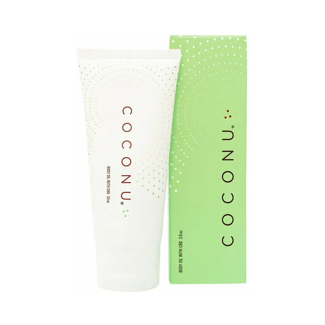 white Coconu hemp-infused body oil tube beside a bright green retail carton