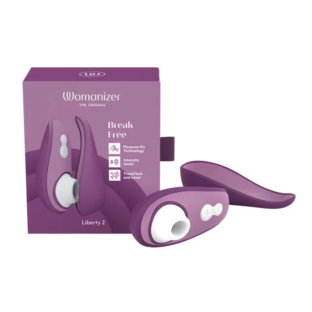 purple Womanizer Liberty 2 with white air head and curved cover beside matching box