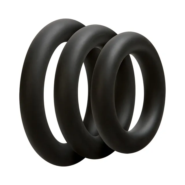 Doc Johnson OptiMALE Thick Ring Set three loose black rings with wide rounded profiles