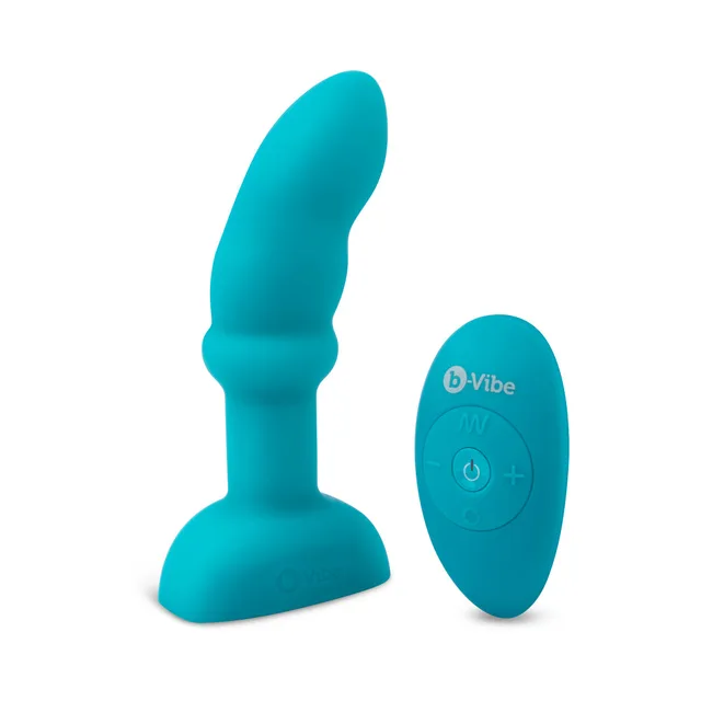 Turquoise b-Vibe curved plug standing beside oval remote