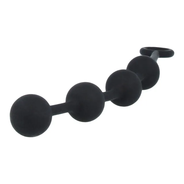 Angled view of four graduated black silicone anal beads