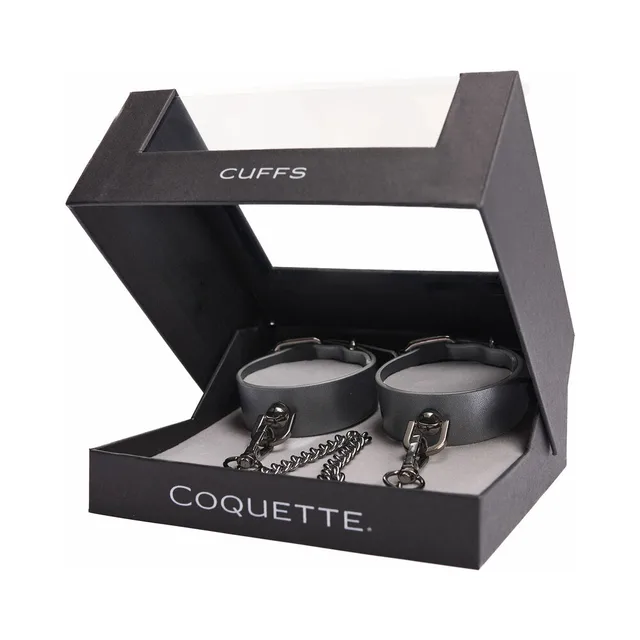 Pair of gray Coquette cuffs with chain inside black display box