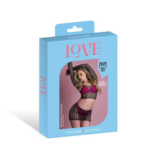 Magic Silk seamless black crop top and skirt set displayed in blue retail packaging