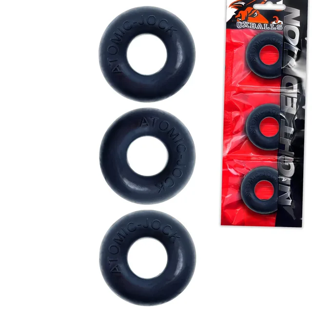Three OxBalls Ringer Night black rings beside red retail packaging