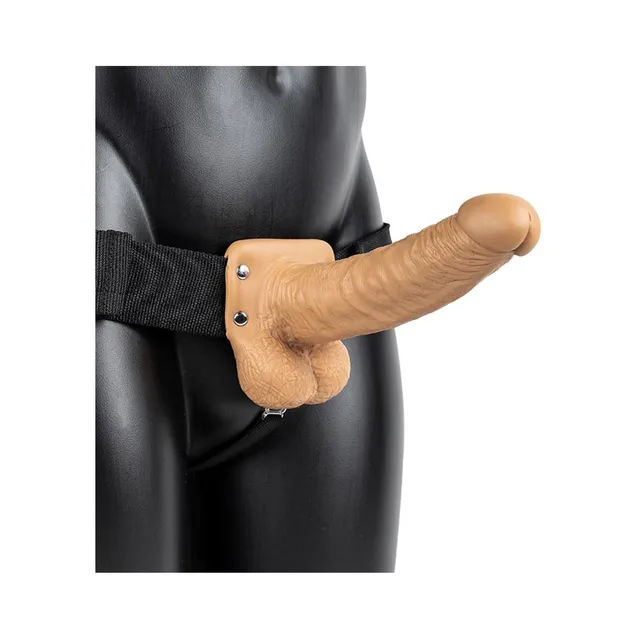 Tan 7-inch RealRock strap-on worn with black harness