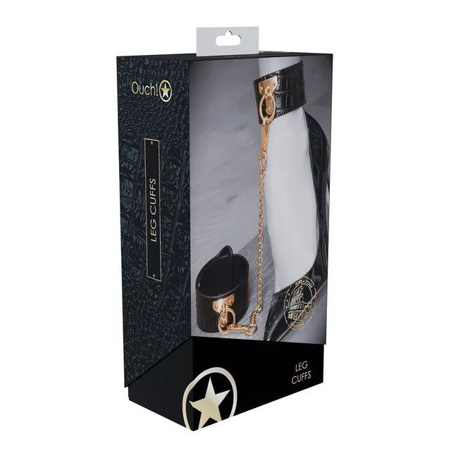 black croc-print Rome leg cuffs with gold connector chain on box