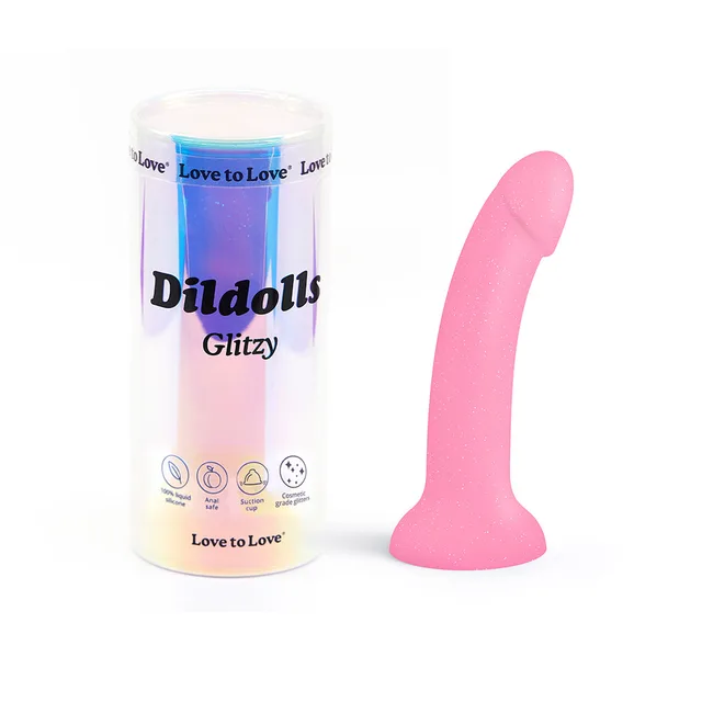 Dildolls Glitzy pink glitter dildo beside cylindrical package