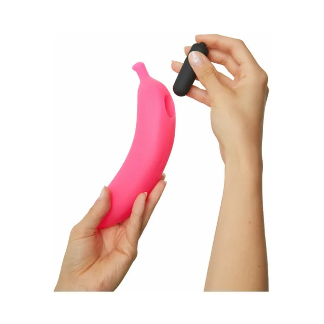 Hands holding pink Oh Oui vibrator and separate black bullet
