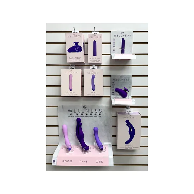 Blush Wellness retail display with five vibrator models, boxed stock and demo stands