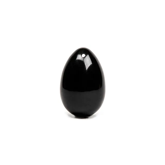 Upright view of black Chakrubs Xaga drilled obsidian yoni egg