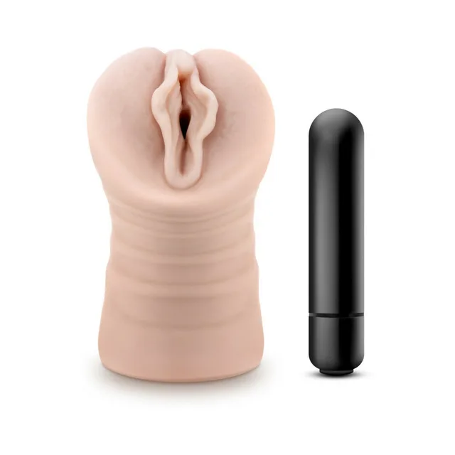 Blush M for Men Ashley stroker upright with molded opening beside black bullet vibrator