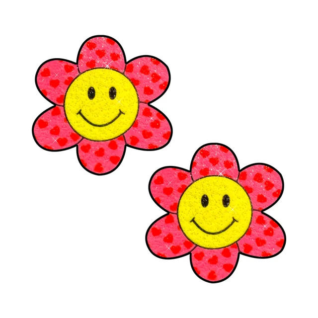 pair of yellow smiley flower nipple pasties with pink heart-print petals