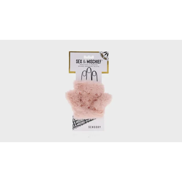 Close front view of pink plush sensory glove with raised studs