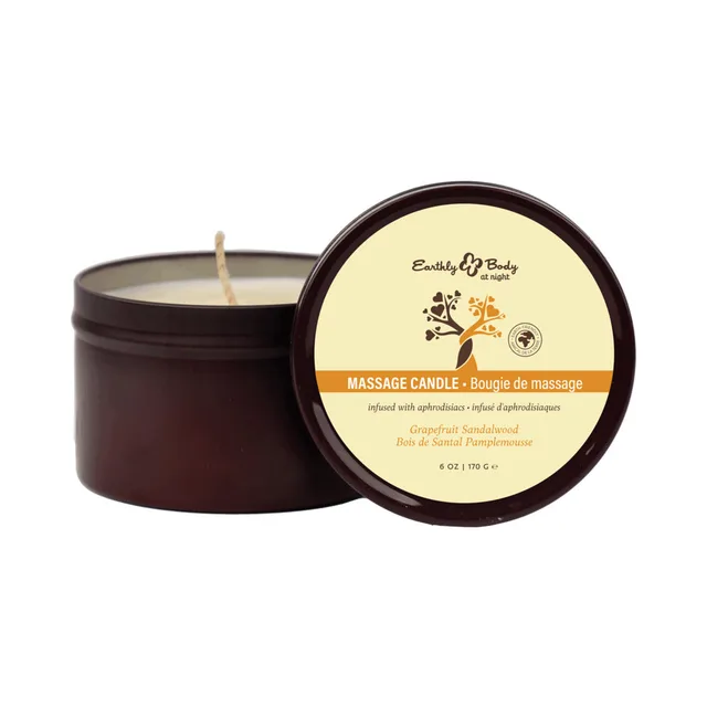 Open Grapefruit Sandalwood candle beside labeled brown tin lid