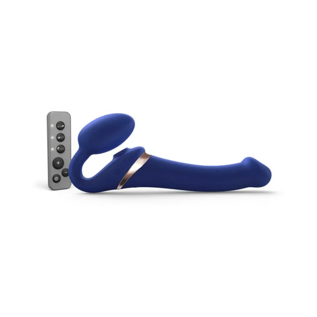 Medium night-blue bendable strapless strap-on beside remote