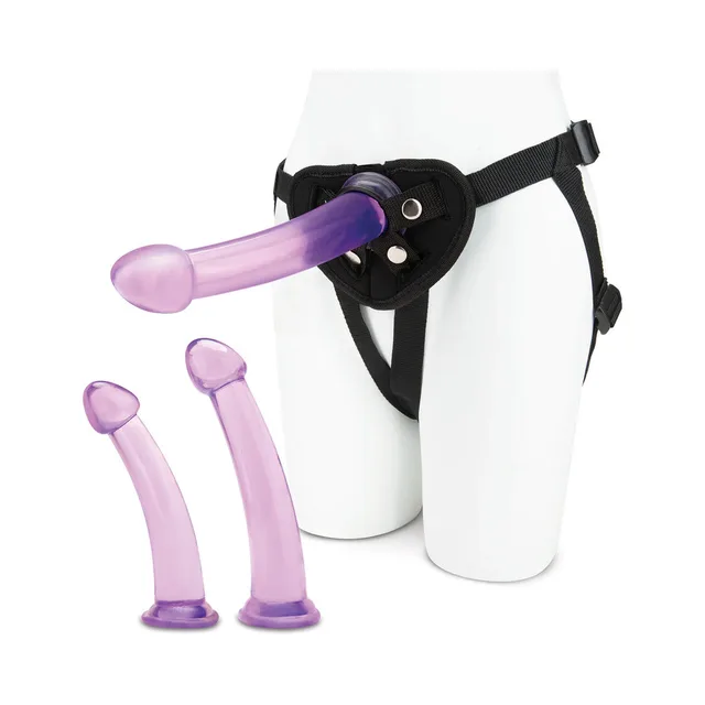 Front view of black harness fitted with purple curved dildo