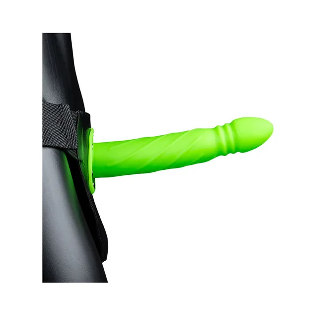 Green spiral-textured hollow strap-on worn with black harness