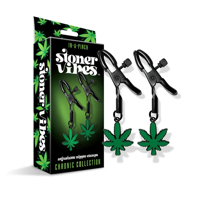 Stoner Vibes black alligator clamps and green charms beside box
