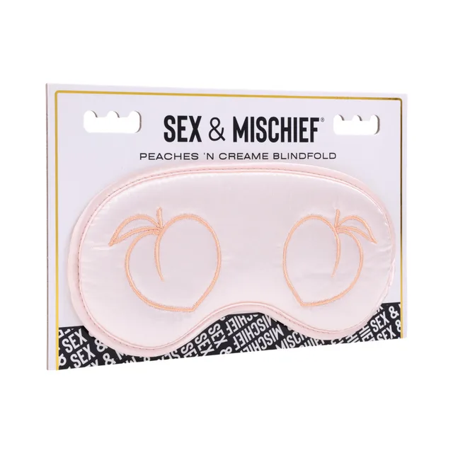 peach satin blindfold with embroidered peach outlines in retail packaging
