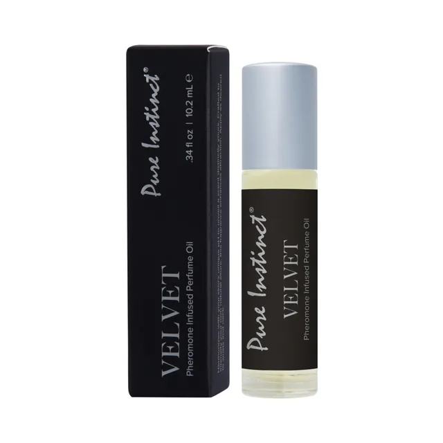 Pure Instinct perfume oil display Velvet roll-on with silver cap beside black box