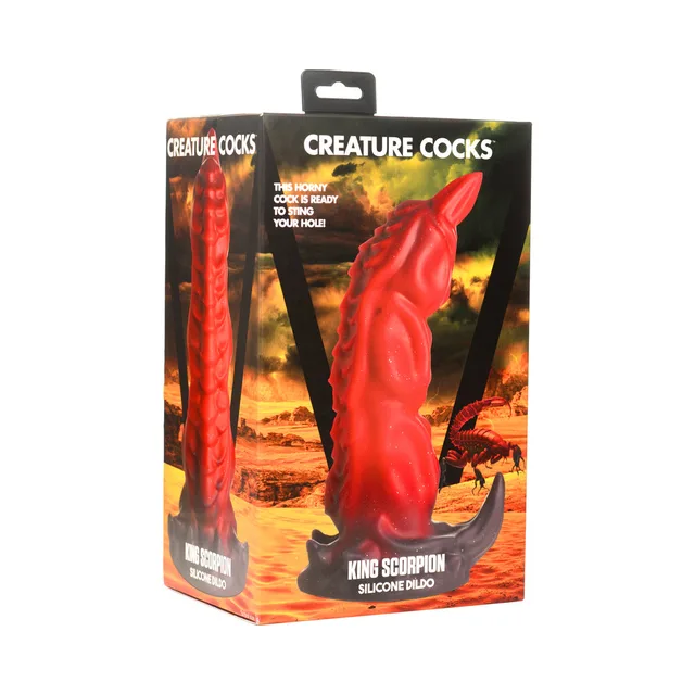 Creature Cocks King Scorpion red segmented dildo beside orange-and-black illustrated retail box
