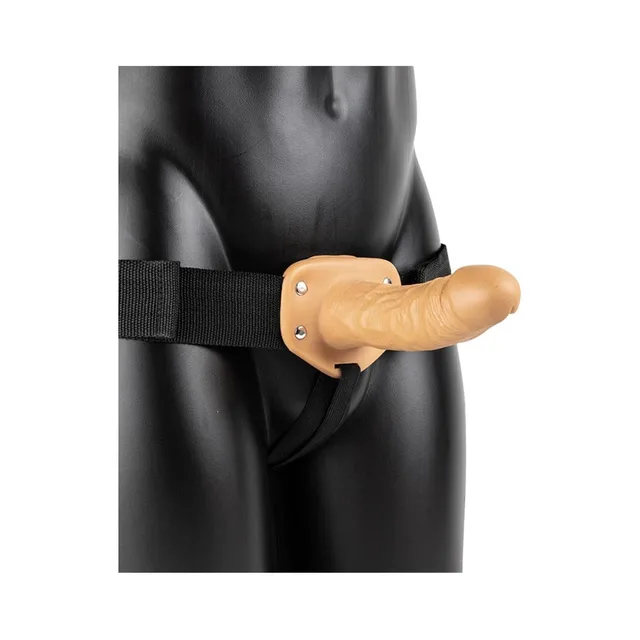 Tan 6-inch RealRock strap-on worn with black harness